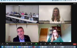 A screenshot of a Zoom meeting featuring four photos: Moore’s students in class (top left), a photo of Moore (top right), a photo of Angus MacNeil (bottom left) and Nikita Harkin, a member of MacNeil’s staff (bottom right).