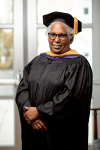 A photo of Schieffer College faculty member Jean Marie Brown dressed in academic regalia.