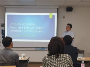 A photo of Dr. Jong-Hyuok Jung presenting his research paper in Seoul, South Korea.