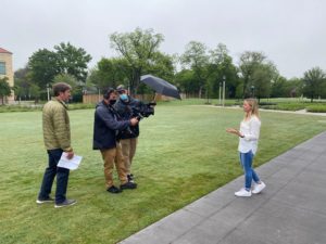 Crew members film TCU student Emily Citarella's segment outdoors.